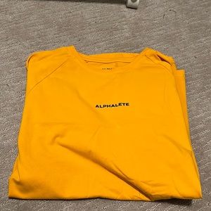 Alphalete shirt in yellow, in medium